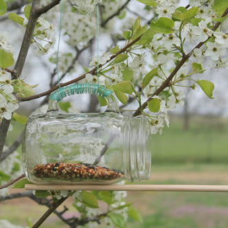 Mason Jar Bird Feeder -- take a mason jar glass and make a fun bird feeder in just minutes.