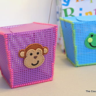 Plastic Canvas Storage Boxes -- a great craft for kids at summer camp or anytime of the year. Helps to teach basic sewing skills as well.