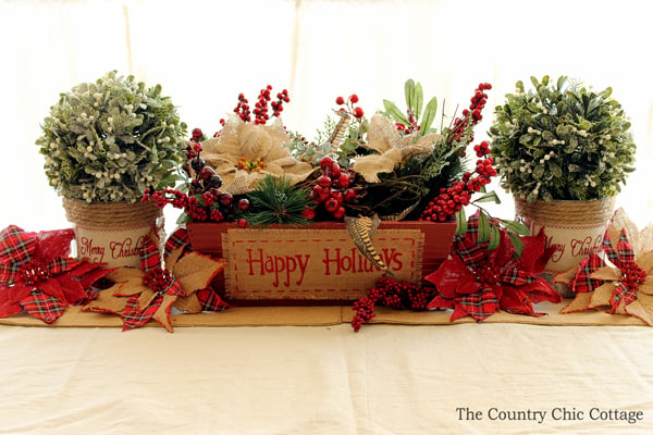 This is a great table centerpiece for Christmas! So easy to put together! I love the burlap poinsettias!