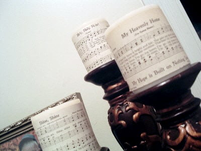 rustic sheet music with candle decor