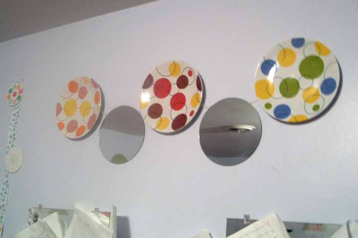 plates and round mirrors hanging on walls