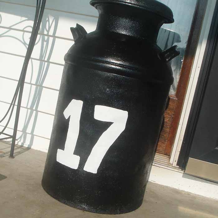 decorative house numbers painted on milk can 