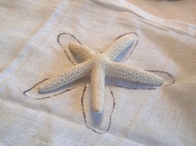 tracing a starfish on a tea towel