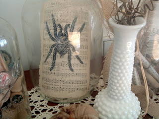 vintage sheet music displayed in glass jug