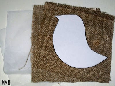 white bird pattern on top of burlap