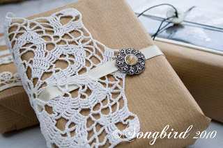 brown package with vintage doilies and broach