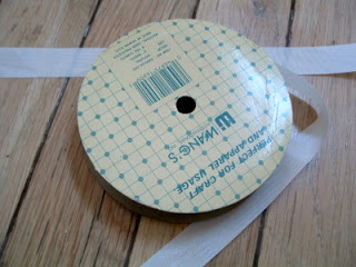 spool of ribbon on wooden deck