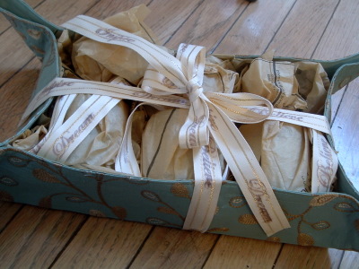 teal fabric box with candle set as a gift