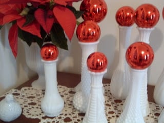 red ornaments on white vases