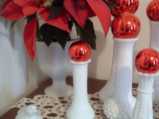close up of Christmas vases on doily