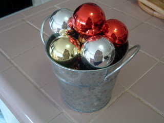 galvanized pail with ornametns