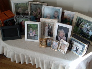 slipcovered coffee table with pictures sitting on top