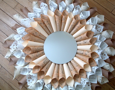 Use rolled vintage paper ephemera to create a one of a kind starburst mirror for any room!