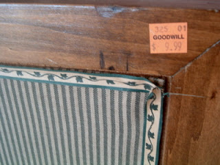 goodwill tag on fabric covered bulletin board