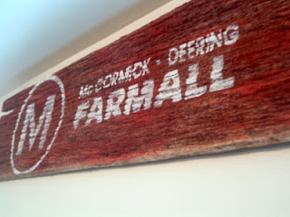 Farmall Barnwood Sign on White wall