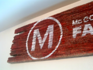 close up of painted barnwood sign