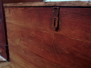 close up of hinges on toy box