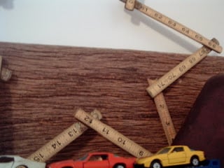 wooden tape measure star on wooden shelf
