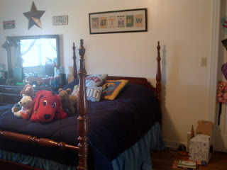boys bed with navy comforter and stuffed animals