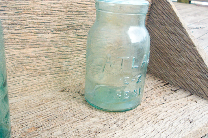 mason jars on barn wood shelf