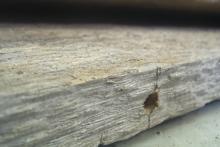 holes drilled in barn wood edge