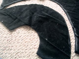 cutting out a pirate hat shaped pattern