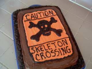 skeleton crossing chocolate cake