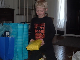 young boy wearing skull and crossbones t shirt