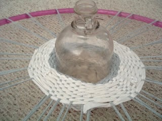 weaving a tshirt basket around a clear glass jug