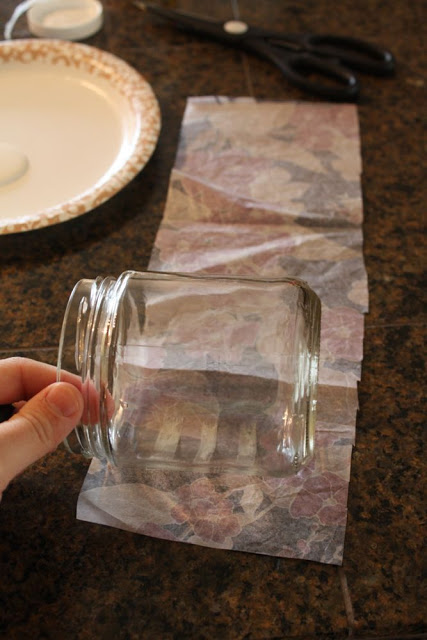 strip of floral tissue paper around a small glass jar