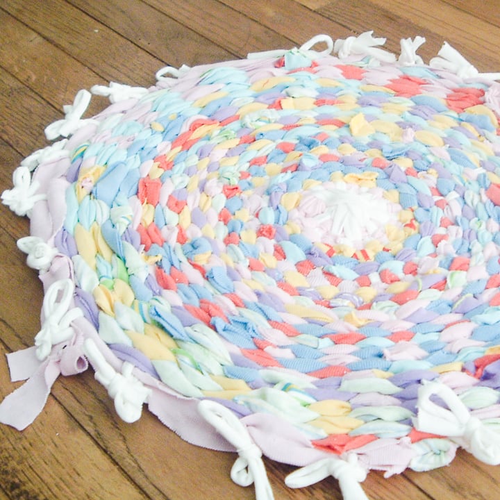 this rag rug is made with a hula hoop and old t-shirts