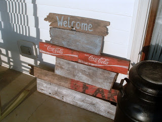 layers of wood farmhouse sign leaned on wall