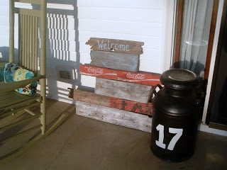 porch with vintage sign and 17 bucket