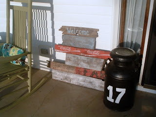 porch with vintage sign and 17 bucket