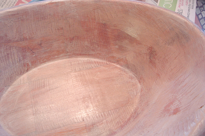 adding paint to a wooden bowl