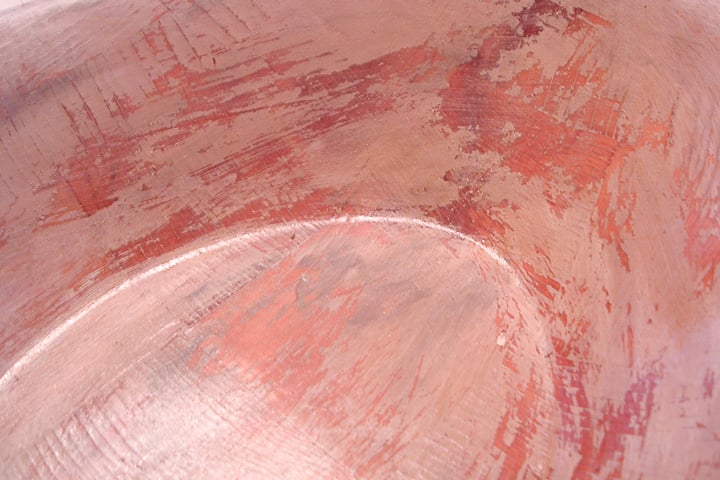 rubbing some paint off of a wood bowl