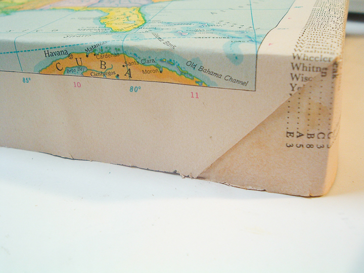 wrapping and securing a map on canvas