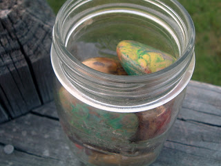 painted rocks in a mason jar