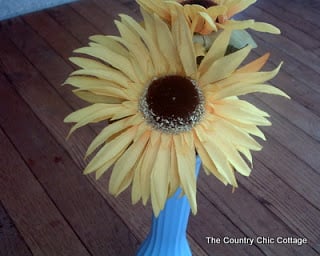 flowers in a painted glass vase