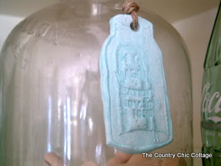 cloche with blue mason jar tag