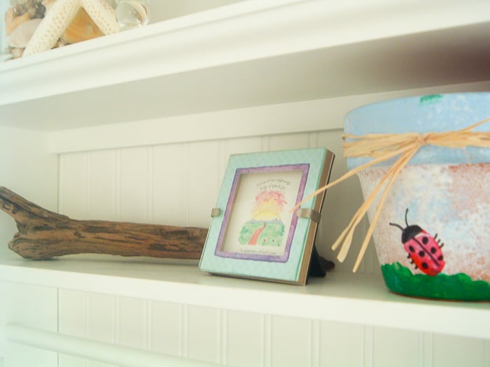 Decorating a theme bathroom with beach decor as well as personal touches.