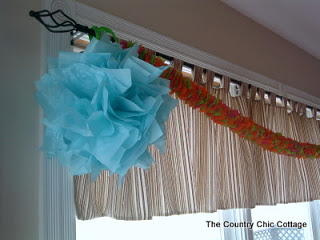 streamers and blue tissue pom