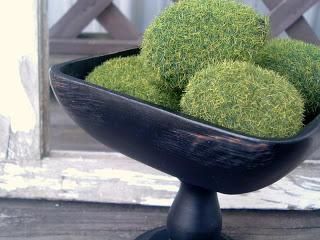 black bowl with mossy rocks