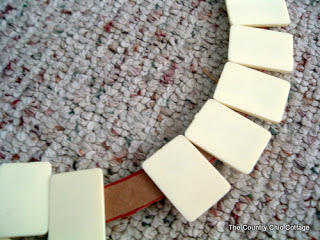 Attaching Rummikub letters to a cardboard wreath form 