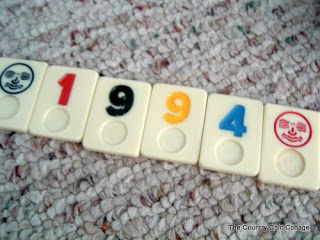 Rummikub letters lined up on carpet