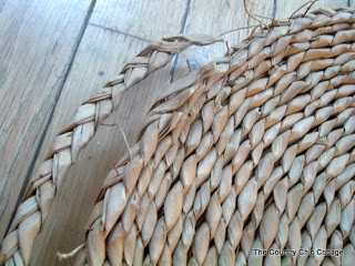 unwinding seagrass cording on wood floor
