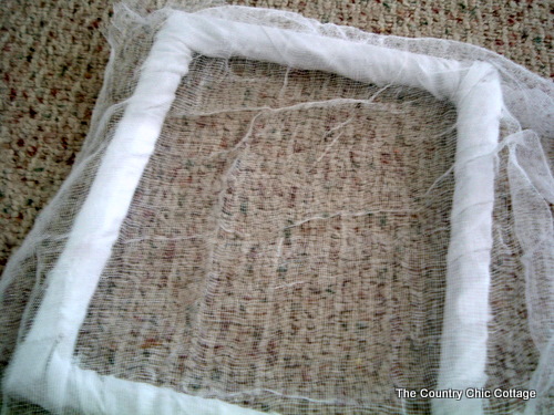 covering a frame in cheesecloth for halloween