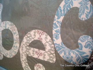 Close up of cut letters on name art.
