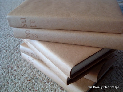 stack of covered books on carpet