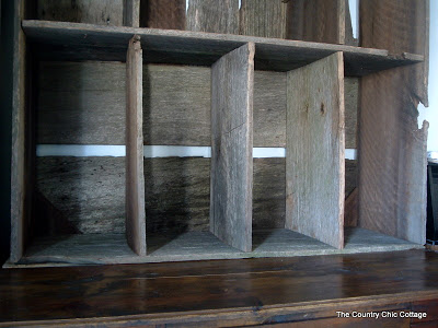 barn wood hutch on top of dark wood desk